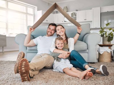 Happy family, portrait and roof with daughter for safety, security or property investment at home. Mother, father and young child or kid with smile on floor for shelter, apartment or house together.