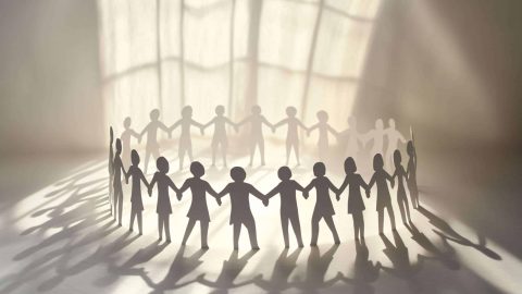 Paper Chain People Holding Hands: Unity and Teamwork Concept