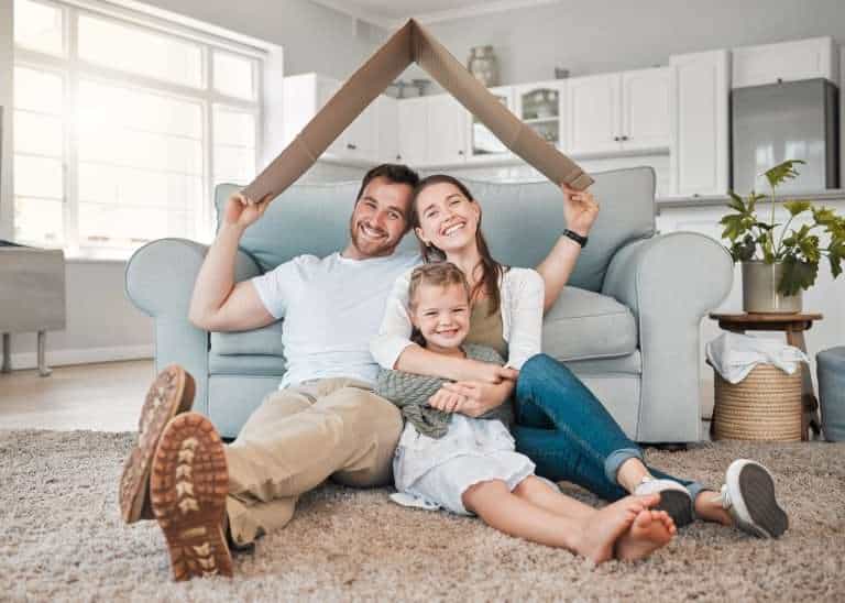 Happy family, portrait and roof with daughter for safety, security or property investment at home