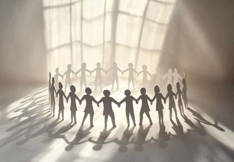 Paper Chain People Holding Hands: Unity and Teamwork Concept